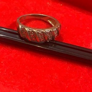 Sterling silver ring with a few actual diamonds.
